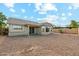 The home features a gravel backyard with covered patio at 89 S 151St Ave, Goodyear, AZ 85338