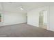 Spacious main bedroom showcasing neutral carpet, an archway to the bathroom, and a ceiling fan at 89 S 151St Ave, Goodyear, AZ 85338