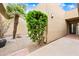 Private courtyard with desert landscaping and a walkway leading to the front door of the home at 9120 N 86Th Way, Scottsdale, AZ 85258