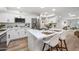 Bright kitchen features white cabinets, stainless steel appliances and an island with seating at 9120 N 86Th Way, Scottsdale, AZ 85258