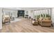 Open living room features hardwood floors, a fireplace and lots of natural light from the windows at 9120 N 86Th Way, Scottsdale, AZ 85258