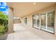 Spacious covered patio offering ample seating and relaxing area with sliding doors to the interior at 9120 N 86Th Way, Scottsdale, AZ 85258