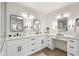 Stylish bathroom vanity with double sinks, sleek black hardware, and modern lighting at 9120 N 86Th Way, Scottsdale, AZ 85258