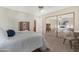 Bright bedroom with a large closet mirror, desk, and comfortable bed at 9349 E Navajo Pl, Sun Lakes, AZ 85248
