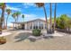 Inviting home with manicured gravel landscaping, mature bushes, and ample parking at 9349 E Navajo Pl, Sun Lakes, AZ 85248