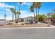 Charming home with beautiful palm trees, easy-care gravel landscaping, and a welcoming facade at 9349 E Navajo Pl, Sun Lakes, AZ 85248
