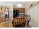 Inviting kitchen with a breakfast area, hardwood flooring, light cabinets, a black refrigerator and backyard views at 9349 E Navajo Pl, Sun Lakes, AZ 85248