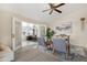 Inviting living room with a ceiling fan, neutral paint and hardwood flooring, perfect for relaxing and entertaining guests at 9349 E Navajo Pl, Sun Lakes, AZ 85248