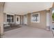 Charming outdoor covered patio with comfortable seating and neutral decor at 9349 E Navajo Pl, Sun Lakes, AZ 85248