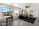 Comfortable sunroom with tile flooring, a ceiling fan, great natural light and a view of the outdoors at 9349 E Navajo Pl, Sun Lakes, AZ 85248