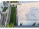 Aerial view of a backyard with artificial grass, privacy walls, and outdoor living spaces at 948 E La Mirada Dr, Phoenix, AZ 85042