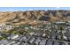 Stunning aerial view of a residential community nestled in the desert near picturesque mountains at 948 E La Mirada Dr, Phoenix, AZ 85042