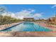 Outdoor community pool with lane lines, seating, and desert landscape views on a bright day at 948 E La Mirada Dr, Phoenix, AZ 85042