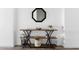 Stylish hallway table featuring decorative items, a mirror, and storage baskets for an organized entryway at 948 E La Mirada Dr, Phoenix, AZ 85042