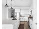 Modern kitchen featuring white cabinets, stainless steel appliances, and a spacious island at 948 E La Mirada Dr, Phoenix, AZ 85042