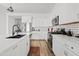 Bright kitchen features white cabinets, a large island, stainless steel appliances, and subway tile backsplash at 948 E La Mirada Dr, Phoenix, AZ 85042