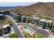Stunning aerial view of modern townhomes with a community pool nestled against a mountain backdrop at 10005 N 1St Dr, Phoenix, AZ 85021