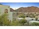 Scenic view of backyard showcasing desert landscaping, surrounding houses, and mountain scenery at 10005 N 1St Dr, Phoenix, AZ 85021
