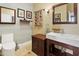 Chic half-bathroom featuring modern fixtures, stylish mirror, and tasteful decor at 10005 N 1St Dr, Phoenix, AZ 85021