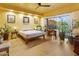 Bright bedroom with hardwood floors, mountain views, and cozy desk area, filled with plants and natural light at 10005 N 1St Dr, Phoenix, AZ 85021