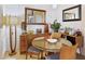 Elegant dining room with mid-century modern furniture, stylish decor, and bright lighting at 10005 N 1St Dr, Phoenix, AZ 85021