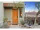 Stunning desert landscape framing a gorgeous wood front door with mountain views at 10005 N 1St Dr, Phoenix, AZ 85021