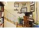 Cozy home office with desk, chair, artwork, and staircase access creating a productive and inviting workspace at 10005 N 1St Dr, Phoenix, AZ 85021