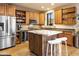 Updated kitchen features stainless steel appliances, granite countertops, custom cabinets, and an island at 10005 N 1St Dr, Phoenix, AZ 85021