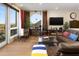 Comfortable living room with a leather sofa, desk, and scenic views from large windows at 10005 N 1St Dr, Phoenix, AZ 85021