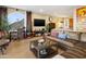 Inviting living room with a leather sofa, flat-screen TV, and a view of the nearby mountains at 10005 N 1St Dr, Phoenix, AZ 85021