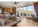 Inviting living room features a leather sectional, views, and an open layout connected to the kitchen at 10005 N 1St Dr, Phoenix, AZ 85021