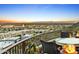 Balcony seating with a grill overlooking a desert city at sunset at 10005 N 1St Dr, Phoenix, AZ 85021