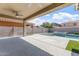 Spacious covered patio overlooking the pool and spa, perfect for enjoying the outdoors in comfort at 10417 W Alyssa Ln, Peoria, AZ 85383