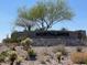Stone sign for community, surrounded by native landscaping at 10417 W Alyssa Ln, Peoria, AZ 85383