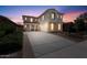 Gorgeous two-story home featuring well-manicured landscaping and a spacious driveway at 10417 W Alyssa Ln, Peoria, AZ 85383