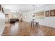 Expansive living room with ample natural light, wood-look floors, and comfortable furniture at 10417 W Alyssa Ln, Peoria, AZ 85383