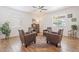 Bright living room showcases a ceiling fan, wood-look floors, and modern decor at 10417 W Alyssa Ln, Peoria, AZ 85383