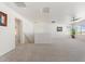 Spacious loft area with neutral carpet, ample natural light, and a ceiling fan at 10417 W Alyssa Ln, Peoria, AZ 85383