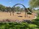 Fun-filled community playground with swings and a slide for children to enjoy at 10417 W Alyssa Ln, Peoria, AZ 85383
