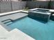 Modern backyard pool and spa with sleek tile, concrete decking, and a private fenced yard at 10417 W Alyssa Ln, Peoria, AZ 85383