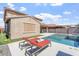 Inviting backyard oasis with a sparkling pool, spa, and comfortable lounge chairs under the sun at 10417 W Alyssa Ln, Peoria, AZ 85383