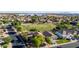 Neighborhood home with mature trees with a park in the distance featuring a baseball field at 10561 E Plata Ave, Mesa, AZ 85212
