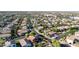 Wide aerial shot of a neighborhood with tree-lined streets and diverse home styles at 10561 E Plata Ave, Mesa, AZ 85212