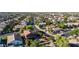 Residential neighborhood home with a landscaped yard and convenient access to a nearby green community park at 10561 E Plata Ave, Mesa, AZ 85212