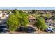 Aerial view of single Gathering home, well landscaped, with mature trees at 10561 E Plata Ave, Mesa, AZ 85212