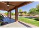Inviting covered back patio leads to outdoor gazebo and well-manicured lawn at 10561 E Plata Ave, Mesa, AZ 85212