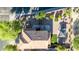 Top-down view of the landscaped backyard with a gazebo, fire pit, seating, and desert landscaping at 10561 E Plata Ave, Mesa, AZ 85212