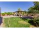 Lush backyard featuring a charming gazebo, gravel and green grass at 10561 E Plata Ave, Mesa, AZ 85212