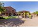 Expansive backyard with gazebo, patio and manicured landscaping at 10561 E Plata Ave, Mesa, AZ 85212