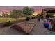 Features a horseshoe pit, privacy fence and lush greenery, perfect for outdoor activities at 10561 E Plata Ave, Mesa, AZ 85212